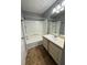 Well-maintained bathroom featuring a shower-tub combo and a vanity sink, providing essential amenities and comfort at 2585 Grassy Point Dr # 313, Lake Mary, FL 32746