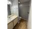 Cozy bathroom featuring neutral tones, a single vanity, and a convenient walk-in closet at 2585 Grassy Point Dr # 313, Lake Mary, FL 32746