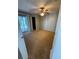 Cozy bedroom with carpet, ceiling fan, and sliding glass doors to a balcony offer comfort and convenience at 2585 Grassy Point Dr # 313, Lake Mary, FL 32746