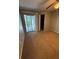 Bedroom featuring plush carpeting, a ceiling fan, and sliding glass doors to a balcony at 2585 Grassy Point Dr # 313, Lake Mary, FL 32746
