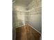 Walk-in closet with built in white wire shelving for ample storage and organization at 2585 Grassy Point Dr # 313, Lake Mary, FL 32746