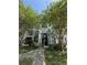 Well-kept condo building with a landscaped walkway leading to the entrance at 2585 Grassy Point Dr # 313, Lake Mary, FL 32746