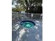 Community hot tub and spa behind a fence to provide privacy and safety at 2585 Grassy Point Dr # 313, Lake Mary, FL 32746