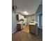 Open kitchen with appliances, light wood cabinets, and a dining area at 2585 Grassy Point Dr # 313, Lake Mary, FL 32746