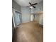 Bright living room featuring sliding glass doors to the balcony and neutral carpeting at 2585 Grassy Point Dr # 313, Lake Mary, FL 32746