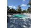 Community pool surrounded by comfortable lounge chairs for relaxation and sunbathing at 2585 Grassy Point Dr # 313, Lake Mary, FL 32746