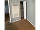 Image shows a deep storage closet with shelving on the right and a utility box on the left at 2585 Grassy Point Dr # 313, Lake Mary, FL 32746