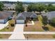 Charming single-story home with a two car garage and mature trees in a quiet neighborhood at 2907 Southern Pines Loop, Clermont, FL 34711