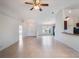 Bright and airy living room features a ceiling fan, tile flooring, and lots of natural light at 2907 Southern Pines Loop, Clermont, FL 34711