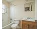 Practical bathroom with a combined shower-tub, simple vanity with sink, and neutral color scheme at 3 Spring Lane Way, Ocala, FL 34472