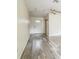 Inviting entryway featuring stylish flooring and a white front door that fills the space with natural light at 3 Spring Lane Way, Ocala, FL 34472