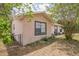 Side view of home showing fenced yard, window details, and corner lot at 3 Spring Lane Way, Ocala, FL 34472