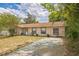 Charming one-story home with a quaint front yard, painted drive, and mature landscaping at 3 Spring Lane Way, Ocala, FL 34472