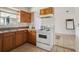 Functional kitchen with a stainless steel sink and white appliances at 3 Spring Lane Way, Ocala, FL 34472