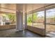 Enclosed patio offering a relaxing outdoor space with views of the fenced backyard and lush greenery at 3 Spring Lane Way, Ocala, FL 34472