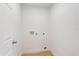 An empty laundry room is ready for a washer and dryer hookup at 3111 Pine Tree Dr, Edgewater, FL 32141