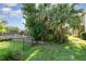 Backyard with Palm trees and lawn at 3321 San Jacinto Cir # 116, Sanford, FL 32771