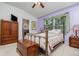 Bedroom with a brass bed, vaulted ceiling, and a wood dresser at 3321 San Jacinto Cir # 116, Sanford, FL 32771