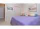 Bright bedroom with a plush bed, closet, and soft lighting at 3321 San Jacinto Cir # 116, Sanford, FL 32771
