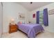 Bedroom featuring a bed, nightstand, and window with curtains at 3321 San Jacinto Cir # 116, Sanford, FL 32771