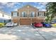 Exterior of a townhouse with a three-car garage and balconies at 3321 San Jacinto Cir # 116, Sanford, FL 32771