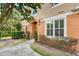 Attractive two-story townhouse showcasing manicured shrubs and a welcoming walkway to the front door at 3321 San Jacinto Cir # 116, Sanford, FL 32771