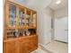 Hallway with tile floors and a large china cabinet at 3321 San Jacinto Cir # 116, Sanford, FL 32771