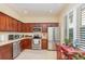 Well-equipped kitchen featuring stainless steel appliances, wood cabinets, and ample counter space at 3321 San Jacinto Cir # 116, Sanford, FL 32771
