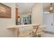 Kitchen breakfast bar with pendant lighting and an adjacent view of the home's entryway at 3321 San Jacinto Cir # 116, Sanford, FL 32771