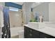 Bathroom featuring a tub shower, and a modern sink with a vanity at 3716 Paradiso Cir, Kissimmee, FL 34746
