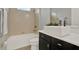 Bathroom featuring a tub shower, and a modern sink with a vanity at 3716 Paradiso Cir, Kissimmee, FL 34746