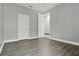 Bedroom featuring laminate wood flooring and a light gray wall color at 3716 Paradiso Cir, Kissimmee, FL 34746
