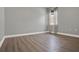 Simple bedroom with hardwood floors and gray walls at 3716 Paradiso Cir, Kissimmee, FL 34746