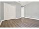 Clean bedroom with hardwood floors and gray walls at 3716 Paradiso Cir, Kissimmee, FL 34746