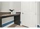A hallway desk area with granite countertops and a white door at 3716 Paradiso Cir, Kissimmee, FL 34746