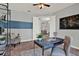 Charming office space with desk, chair, modern shelving, and an open doorway at 3716 Paradiso Cir, Kissimmee, FL 34746
