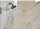 Shower with hexagon accent wall and rainfall shower head at 3716 Paradiso Cir, Kissimmee, FL 34746