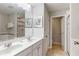 Bathroom with double sink vanity, shower, tub, toilet and tile floors at 4201 Oakview Dr, Davenport, FL 33837