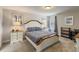Comfortable bedroom with a queen bed, two nightstands, and an accent wall at 4201 Oakview Dr, Davenport, FL 33837