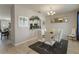 Dining room with seating for six, an open floor plan, and views into the kitchen at 4201 Oakview Dr, Davenport, FL 33837