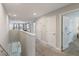 Upstairs hallway with carpet, doors to bedrooms, and views of a living room at 4201 Oakview Dr, Davenport, FL 33837