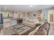 Bright living room with tile floors, neutral walls, and comfortable seating near kitchen bar at 4201 Oakview Dr, Davenport, FL 33837