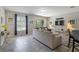 Spacious living room with tile floors, neutral walls, and a sliding glass door at 4201 Oakview Dr, Davenport, FL 33837
