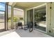 Cozy screened patio with comfortable seating and sliding glass door access at 4201 Oakview Dr, Davenport, FL 33837