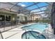 Inviting screened-in pool and spa, perfect for outdoor relaxation at 4201 Oakview Dr, Davenport, FL 33837