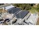New homes under construction featuring modern design elements and a gray roof, near other structures at 59 W 10Th St, Apopka, FL 32703
