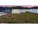New home's backyard with lush grass, offering ample space for outdoor activities at 59 W 10Th St, Apopka, FL 32703