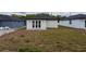 Backyard with patio and freshly laid grass, ready for outdoor activities and relaxation at 59 W 10Th St, Apopka, FL 32703