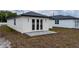 Backyard view with new patio, promising outdoor enjoyment and relaxation at 59 W 10Th St, Apopka, FL 32703