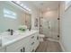 Modern bathroom with double vanity, glass shower, and updated fixtures at 59 W 10Th St, Apopka, FL 32703